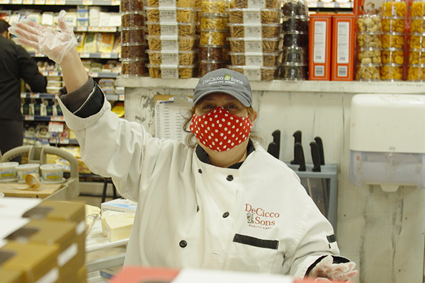 Staff with mask waving