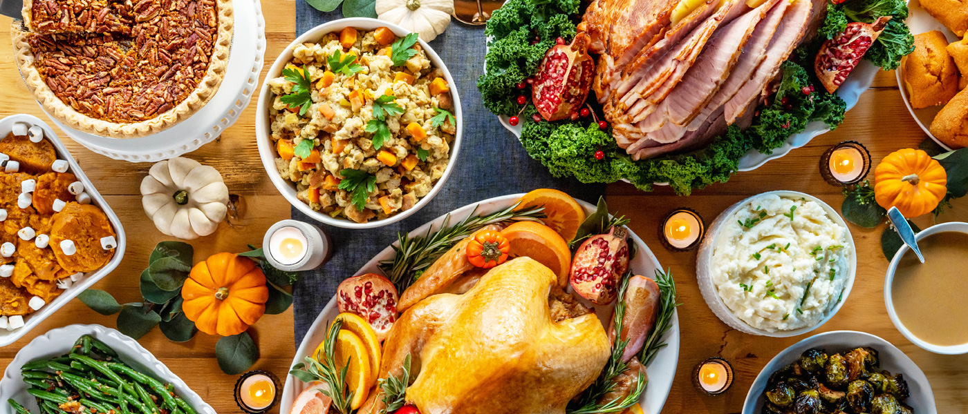 Holiday Catering food spread with turkey, ham, sides, and more